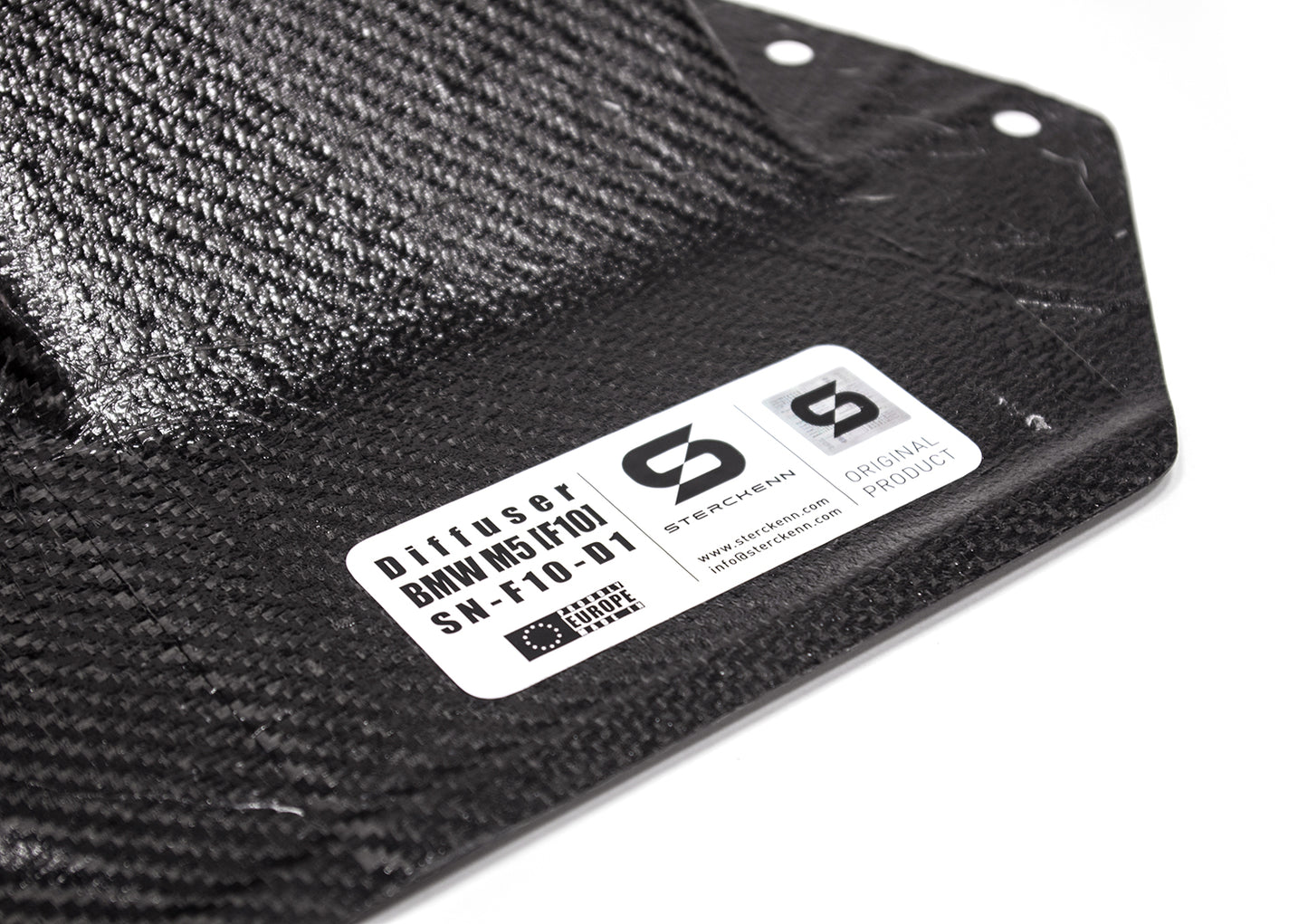 close-up on black diffuser with white sticker