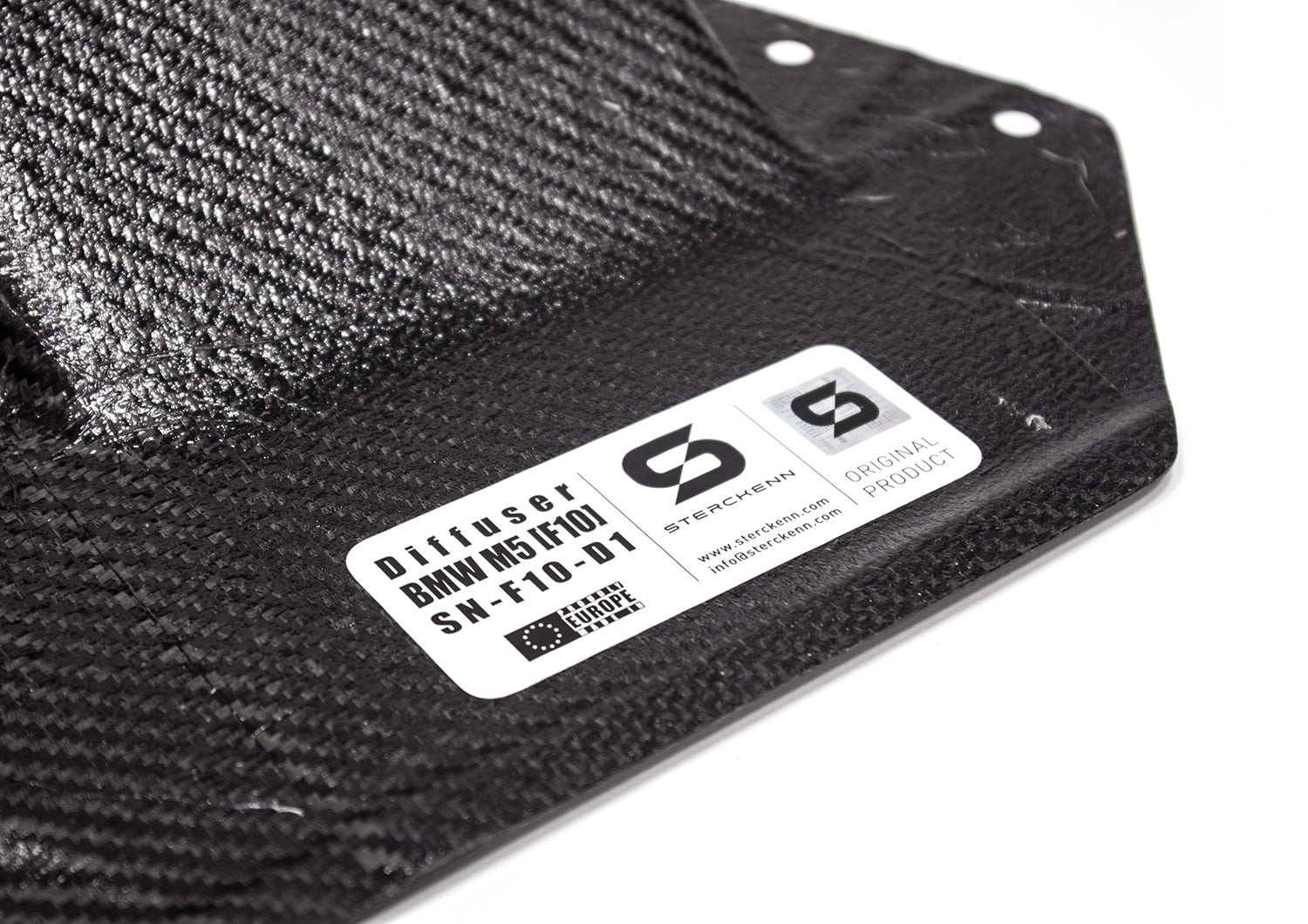 close-up on black diffuser with white sticker