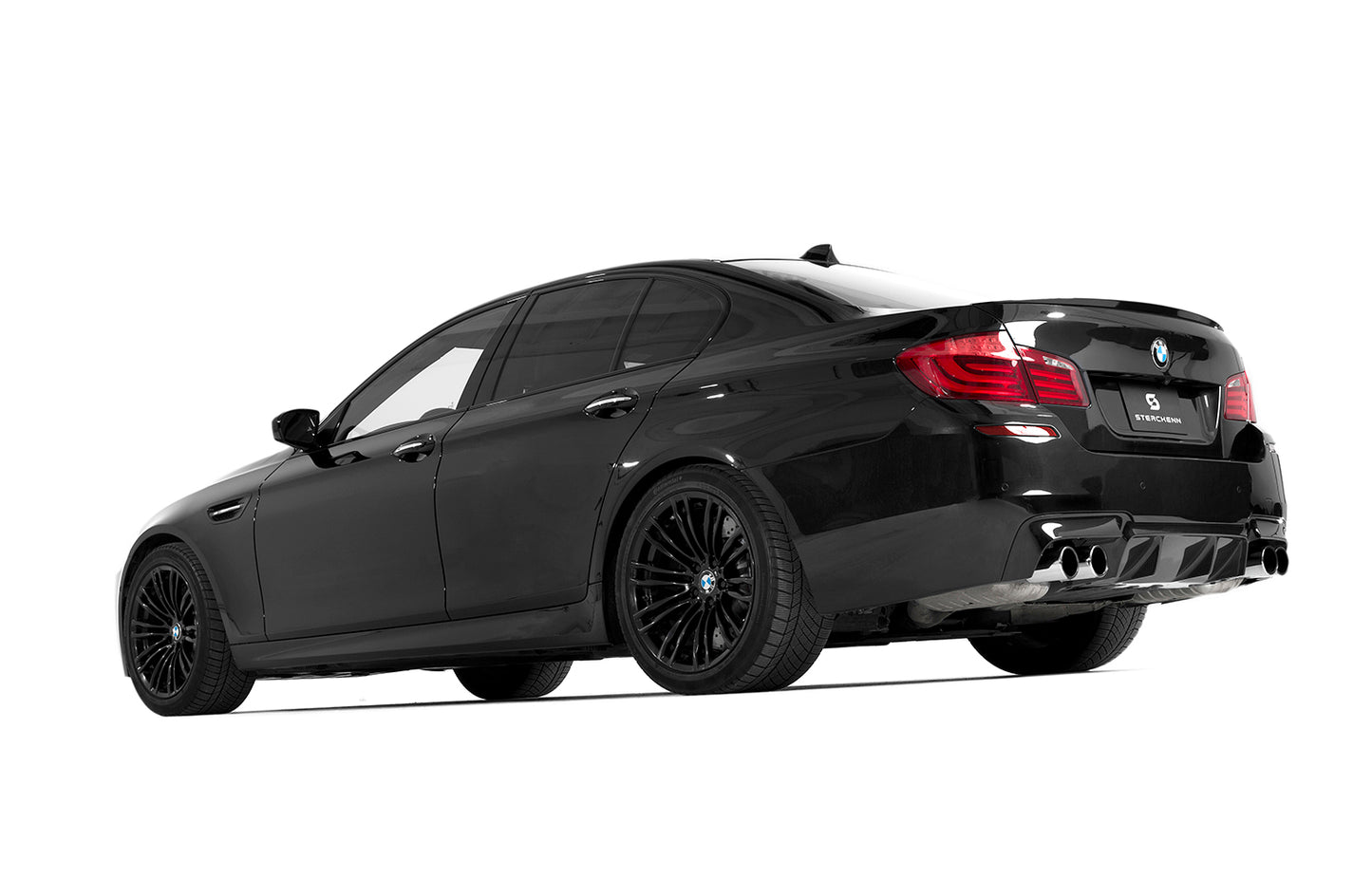 back view of black bmw on white background