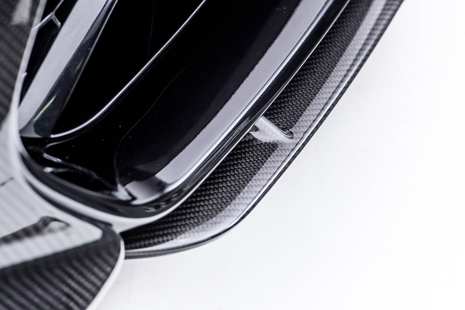fragment of black glossy splitter on white background