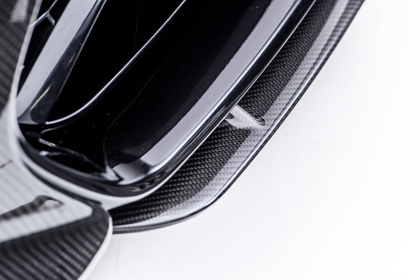 fragment of black glossy splitter on white background